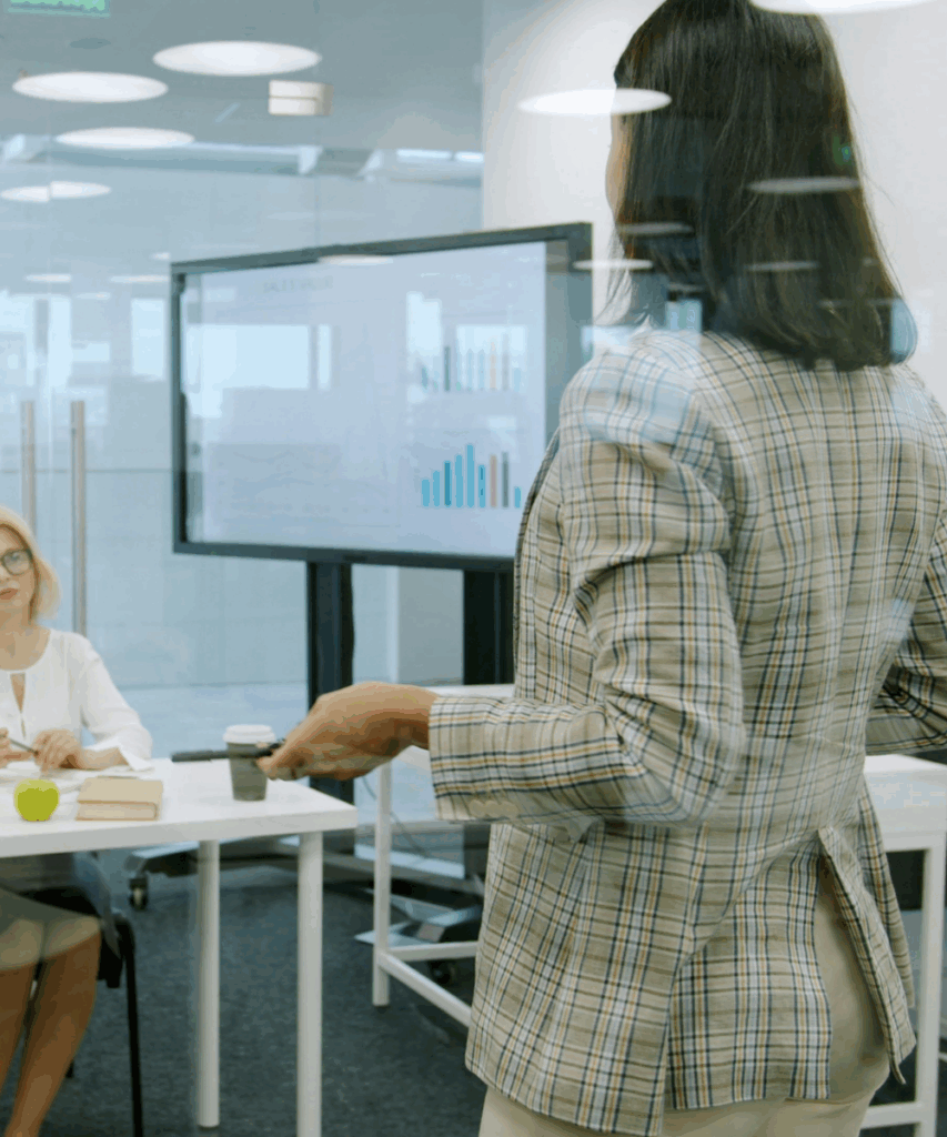 Woman speaking in front of audience.